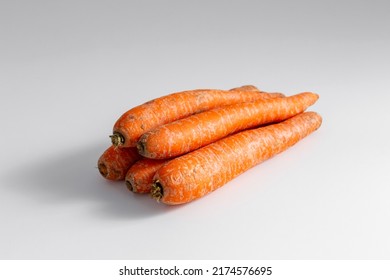 food, vegetables and healthy eating concept - close up of ripe carrots on table