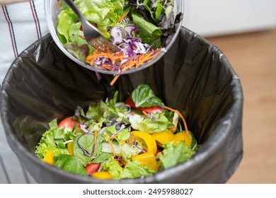 Food waste environment concept, people throwing food garbage into bin prepare to decompose. - Powered by Shutterstock