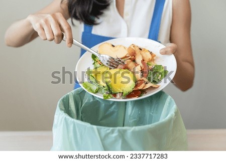 Food waste environment concept, people throwing food garbage into bin prepare to decompose.
