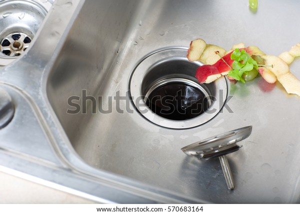 Food waste left in a sink.\
Closeup
