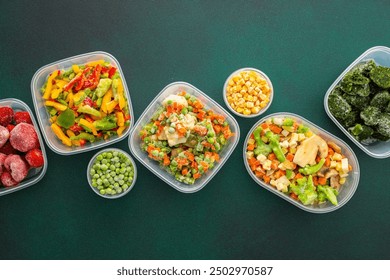 Food in winter, freezing fresh vegetables in summer in the refrigerator, various frozen vegetables in plastic dishes in the middle of the background, top view, background of containers with vegetables - Powered by Shutterstock