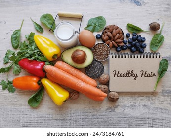 Foods for healthy long hair. Best foods for shiny, strong hair. Diet for hair growth and thickness. Berries, carrot, nuts, avocado, bell peppers, spinach, eggs, chia seeds. Concept of hair growth food - Powered by Shutterstock