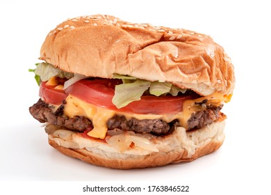 Foods High In Cholesterol And Saturated Fat, Fast Food And Unhealthy Diet Concept With Low Key Picture Of Delicious American Cheeseburger Isolated On White Background With Clipping Path Cutout