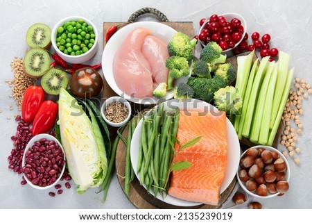 Foods with low glycemic index on gray background. Healthy food concept. Top view, flat lay
