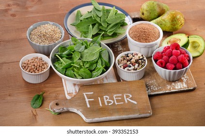 Foods rich in Fiber on a wooden table. Healthy eating. Selective focus - Shutterstock ID 393352153