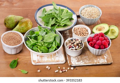 Foods rich in Fiber on a wooden background. Healthy eating. Selective focus - Shutterstock ID 393352183
