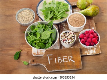 Foods rich in Fiber on a wooden background. Healthy eating. Top view - Shutterstock ID 393353554