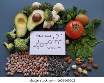 Foods Rich In Folic Acid (vitamin B9) With Structural Chemical Formula Of Folic Acid. Natural Food Sources Of Vitamin B9: Avocado, Cauliflower, Broccoli, Eggs, Tomato, Spinach, Beans, Nuts, Parsley.