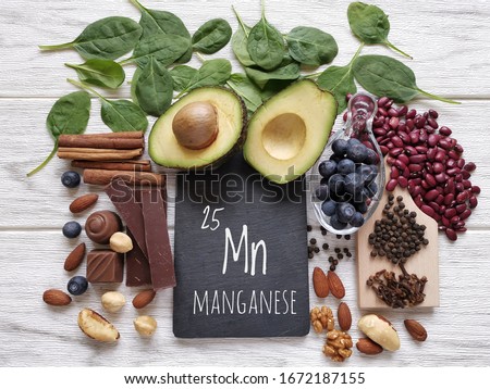 Foods rich in manganese with the chemical symbol Mn for the chemical element manganese. Natural sources of manganese: avocado, cloves, cinnamon, black pepper, spinach, dark chocolate, beans, blueberry