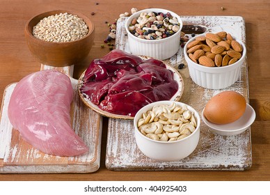 Foods With Selenium  On A Rustic Wooden Board.