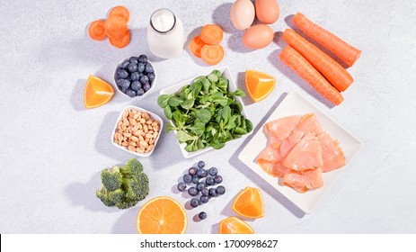 Foods That Help Maintain Eyes Healthy, Products For Keeping Good Vision. Black Board With Copy Space, Assortment Of Food For Eye Health On Concrete Background, Flat Lay, Top View