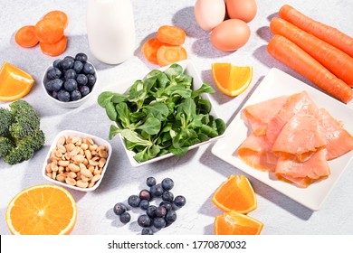 Foods That Help Maintain Eyes Healthy, Supplements For Keeping Good Vision, Vitamins For Eyes. Assortment Of Food For Eye Health On Concrete Background, Flat Lay, Top View