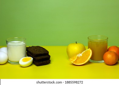 Foods You Can Eat On A Bland Diet. Time To Lose Weight. Milk, Bread, Eggs, Juice, Fruits On Yellow And Green Background. Concept Of Healthy Eating. Copy Space.