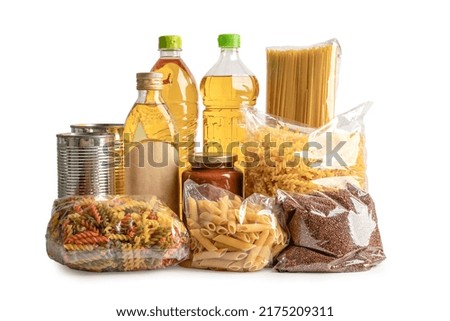 Foodstuff for donation, storage and delivery. Various food, pasta, cooking oil and canned food in cardboard box.