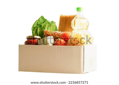 Foodstuffs in donation box isolated on white background with clipping path for volunteer to help people.