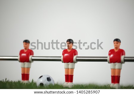 Foosball table soccer game red players
