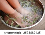 Foot baths with rosemary leaves