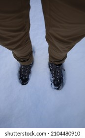 Foot And Boots Buried In Snow