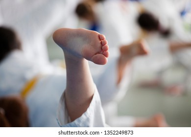 Foot of the child during training of judo in a gym