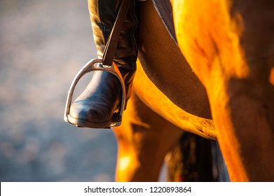 Foot In Horse Stirrup, Close-up. Horse Theme 