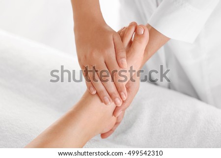 Similar – Female receiving treatment by professional osteopathy therapist