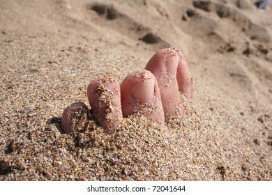 foot on the sand, summer theme