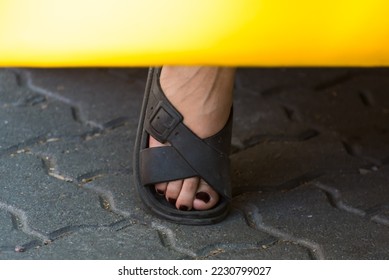 foot on the street, person getting out of a car - Shutterstock ID 2230799027
