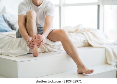 Foot Pain, Man Suffering From Feet Ache At Home, Podiatry Concept