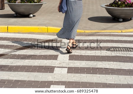 foot pedestrian crossing on city street closeup