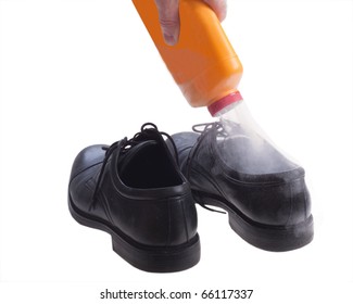 Foot Powder Being Poured Into Shoe To Control Odor.