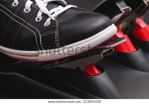 Foot pressing the gas\
pedal. Close up.