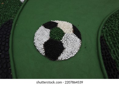 Foot Reflexology Massage By Stepping On Sharp Stones. The Egg Pebbles Are Arranged And Cemented In A Circular Pattern To Create An Attractive Foot Reflection Walkway In The Fitness Corner Area.