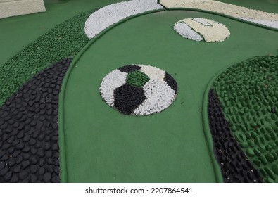 Foot Reflexology Massage By Stepping On Sharp Stones. The Egg Pebbles Are Arranged And Cemented In A Circular Pattern To Create An Attractive Foot Reflection Walkway In The Fitness Corner Area.