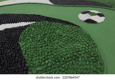 Foot Reflexology Massage By Stepping On Sharp Stones. The Egg Pebbles Are Arranged And Cemented In A Circular Pattern To Create An Attractive Foot Reflection Walkway In The Fitness Corner Area.