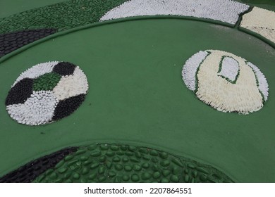 Foot Reflexology Massage By Stepping On Sharp Stones. The Egg Pebbles Are Arranged And Cemented In A Circular Pattern To Create An Attractive Foot Reflection Walkway In The Fitness Corner Area.