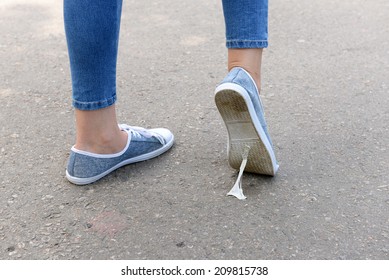 Foot Stuck Into Chewing Gum On Street