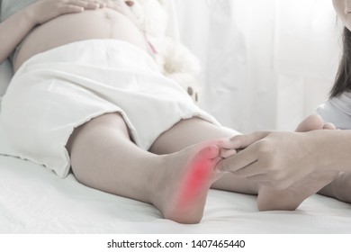 Foot Swelling Of Pregnant Women On Bed And Doctor