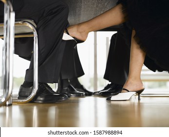 Foot under table. Barefoot under Table. Feet under Table. Suburban feet under Table. Footsie Table.