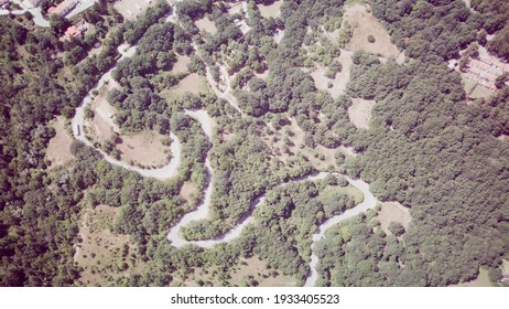 Footage B Roll Of Aerial View Drone Flying Above Landscape Serpentine Winding Road. Drone 4K Video, Road Winding On The Mountains In Summer Sunny Day