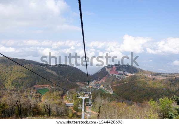 Footage of chairlift and\
mountain climb