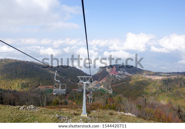 Footage of chairlift and\
mountain climb