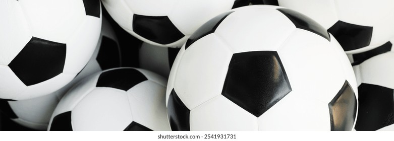 Football background. Soccer balls, featuring classic black and white patterns. Soccer balls stacked together, showcasing their iconic design. Perfect for soccer enthusiasts. Sports background. - Powered by Shutterstock