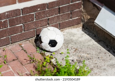a football ball abandoned in a backyard, outdoor cropped shot - Shutterstock ID 2193504189