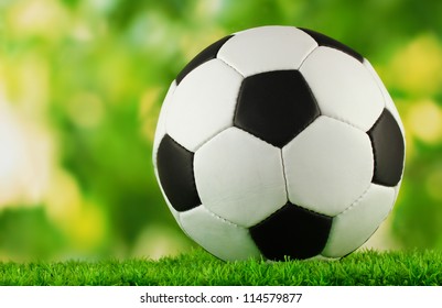 football ball on green grass