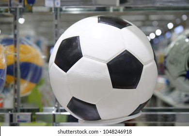 Football Ball On The Shelf For Sales In The Sports Shop Of Department Store.