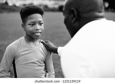 Football Coach Advising The Goalkeeper