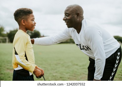 Football Coach Advising The Goalkeeper