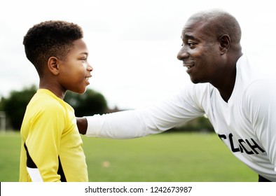 Football Coach Advising The Goalkeeper