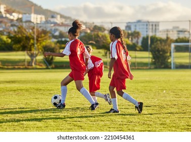 Football, Competition And Soccer Athlete Or Teen Group Play Game, Training And Practice On Grass. Girl With A Ball Running, Fitness And Exercise On A Sports Club Field With A Team Of Young People