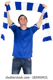 Football Fan In Blue Holding Scarf On White Background